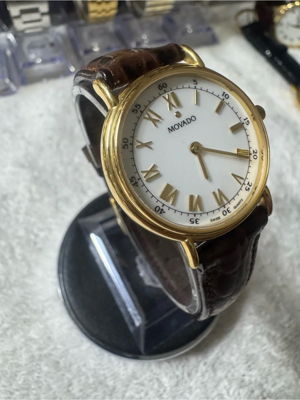 #120 Movado Gold Tone Case White Dial Watch with Brown Leather Strap
